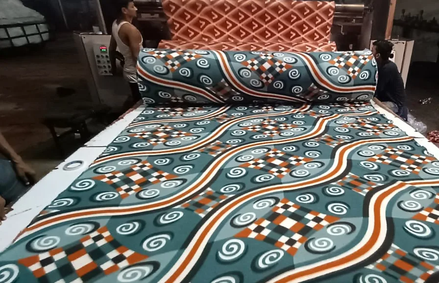 1000 GSM printed polar fleece blanket fabric in a teal and orange swirl print