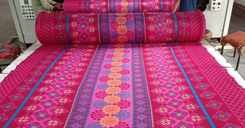 600 GSM printed polar fleece blanket fabric in a pink ikat border design