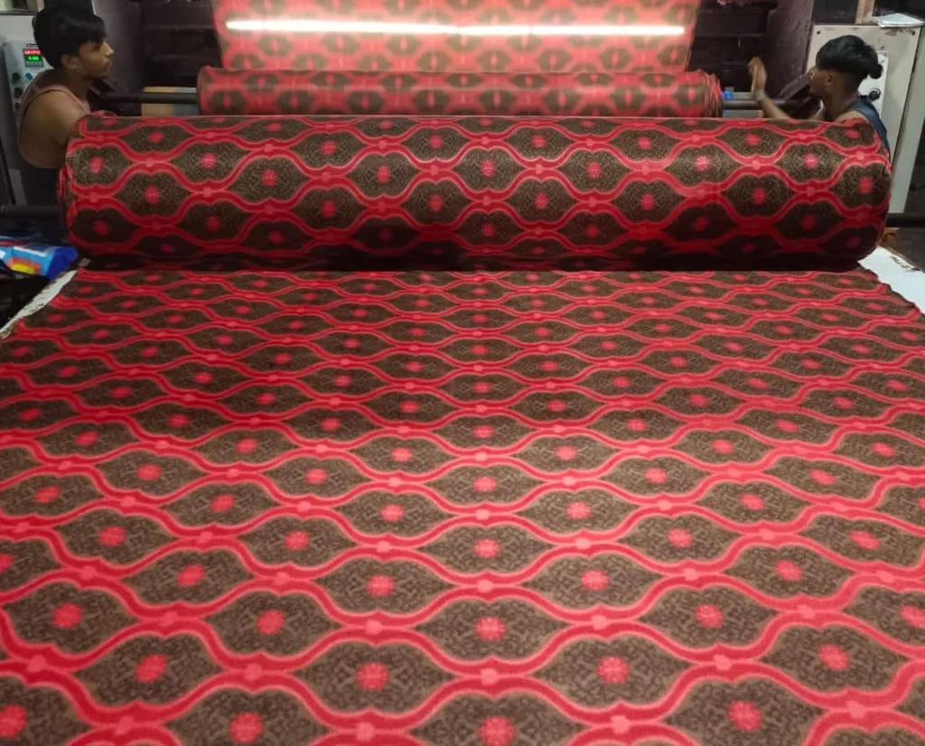 600 GSM printed polar fleece blanket fabric in a red and brown ogee lattice print