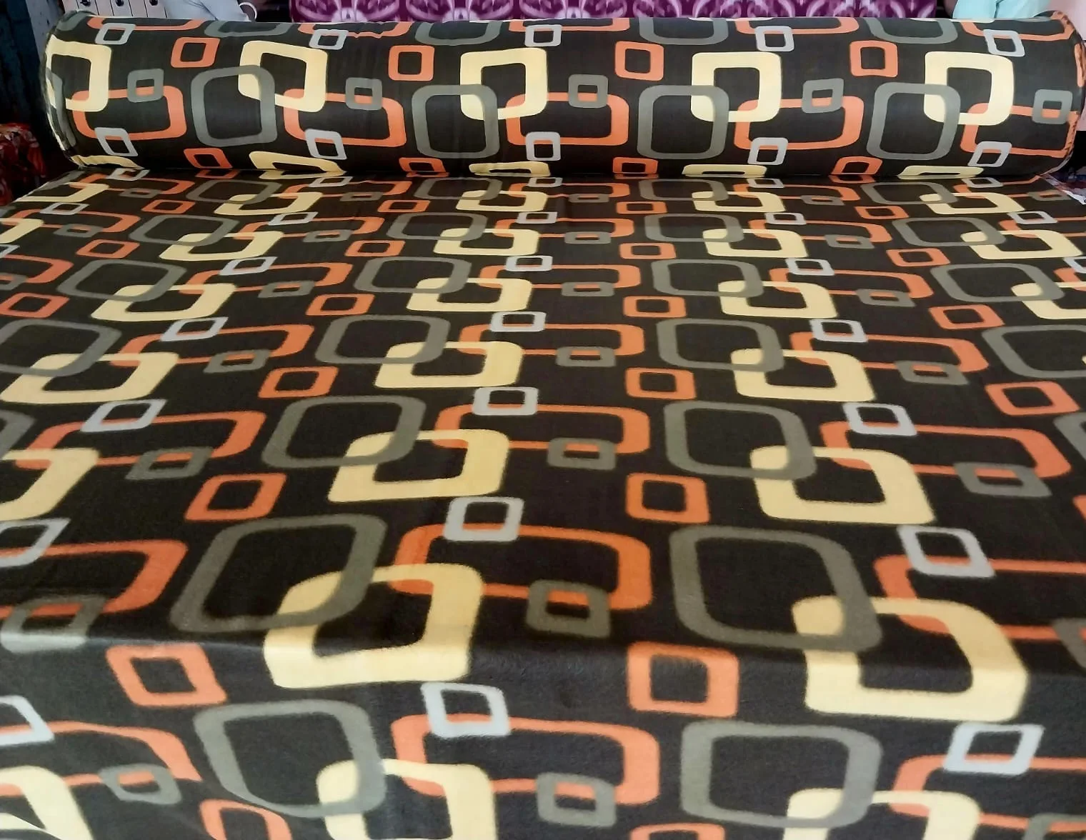 700 GSM printed polar fleece blanket fabric in a brown, orange and cream retro square print