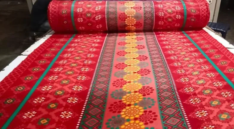 Snow fleece dohar fabric in a red ikat panel