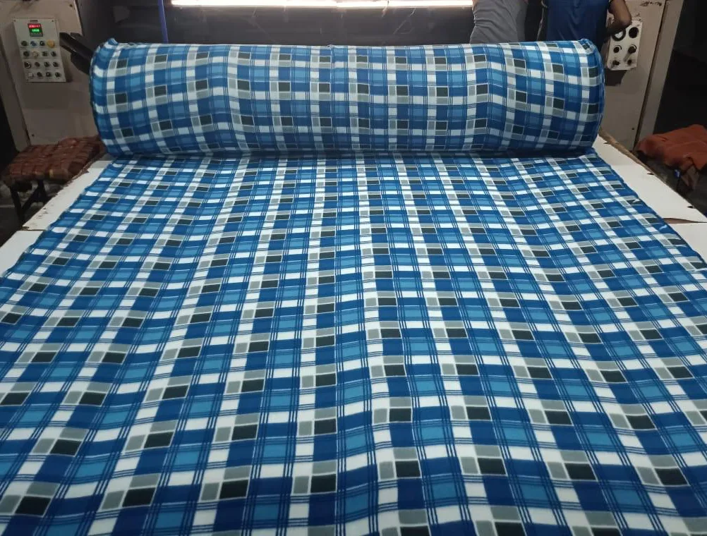 Snow fleece dohar fabric in a blue, grey and white check print