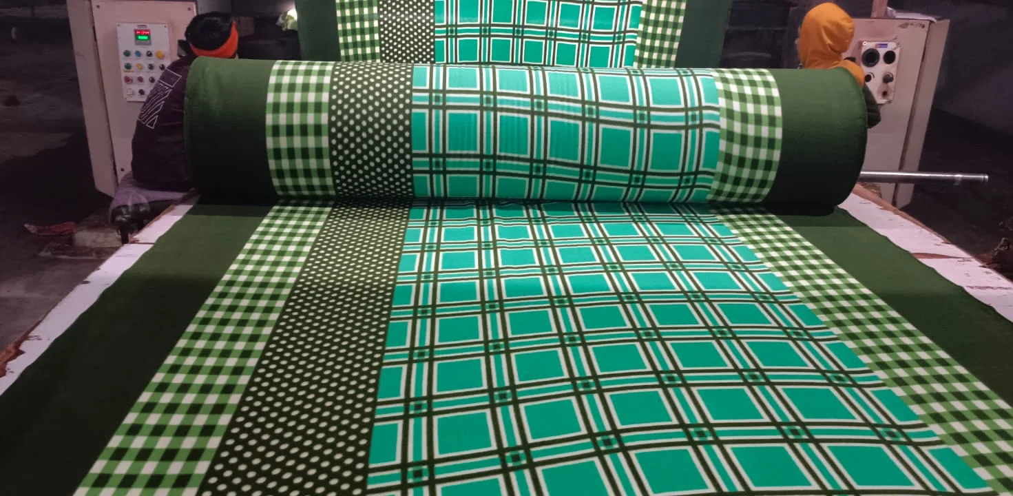 Snow fleece dohar fabric in a green and white check and polka dot print