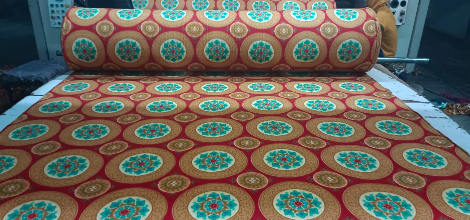 Snow fleece dohar fabric in a red and gold mandala print