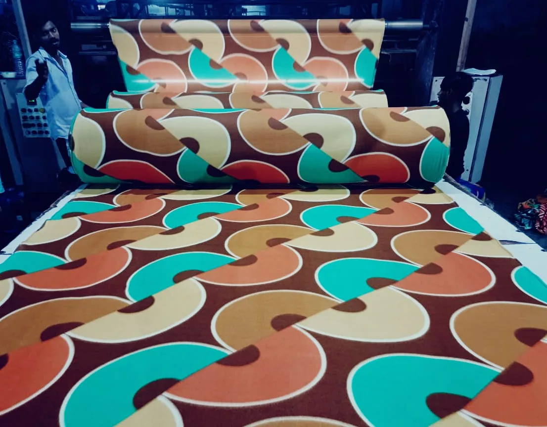 Snow fleece dohar fabric in a brown, teal and orange retro swirl print